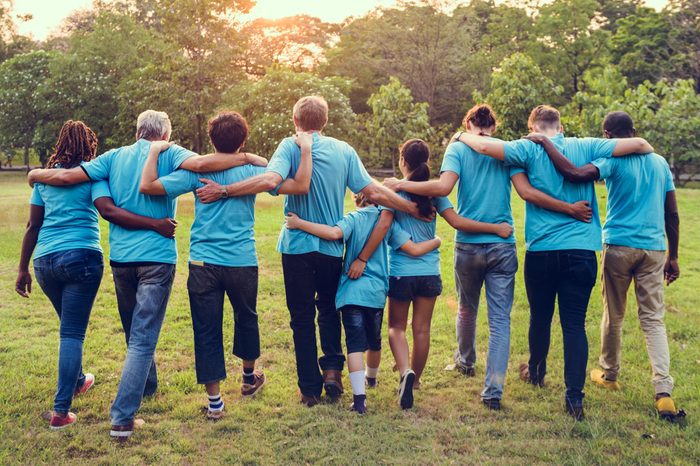 Group of diversity people volunteer arm around