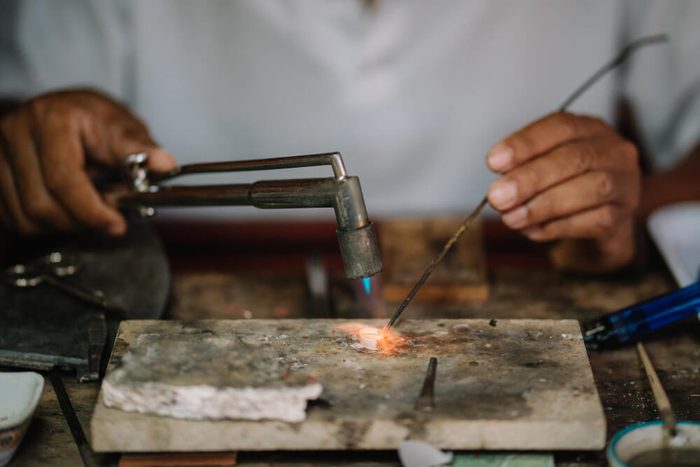 Asians are using fire to bring silverware to add to the beauty of diamonds were paired together ,Learning skills concept.