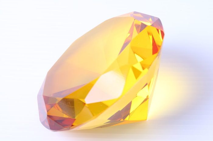yellow diamond on white surface