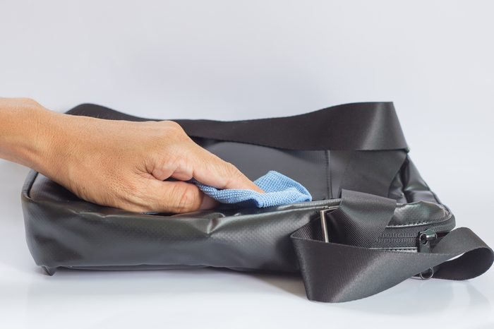Black Leather Bag cleaning with a Microfiber Cloth