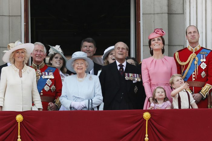 Members of Britain's Royal family from left, Camilla, Camilla Duchess of Cornwall, Prince Charles, Princess Eugenie, Queen Elizabeth II, background Tim Laurence, Princess Beatrice, Prince Philip, Kate, Catherine Duchess of Cambridge, Princess Charlotte, Prince George and Prince William watch a fly past as they appear on the balcony of Buckingham Palace, after attending the annual Trooping the Colour Ceremony in London
