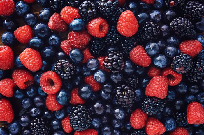 blueberries, raspberries and black berries shot top down