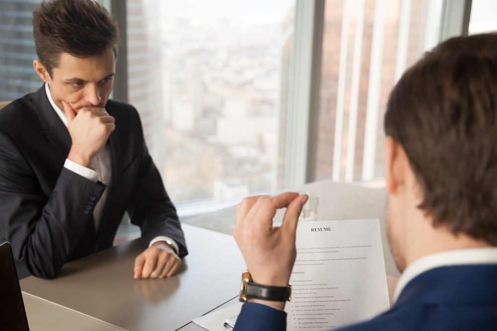 Worried unhired job applicant feeling nervous while employer or recruiter reviewing bad resume, unprepared vacancy candidate waiting for result, afraid to fail employment interview and be rejected