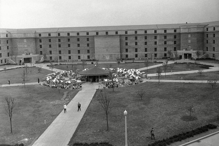 General view of the court in the Pentagon Building in Washington, showing the restaurant surrounded by umbrella covered tables where employees enjoy outdoor lunches
