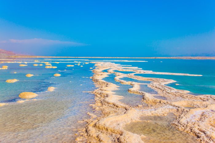 The concept of medical and ecological tourism. The evaporated salt. Reduced water in the very salty Dead Sea. Therapeutic Dead Sea, Israel