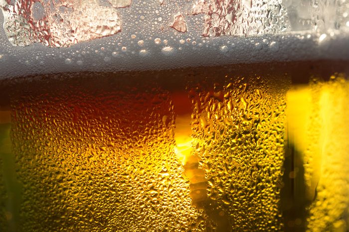 beer close-up, backlit by golden Sun