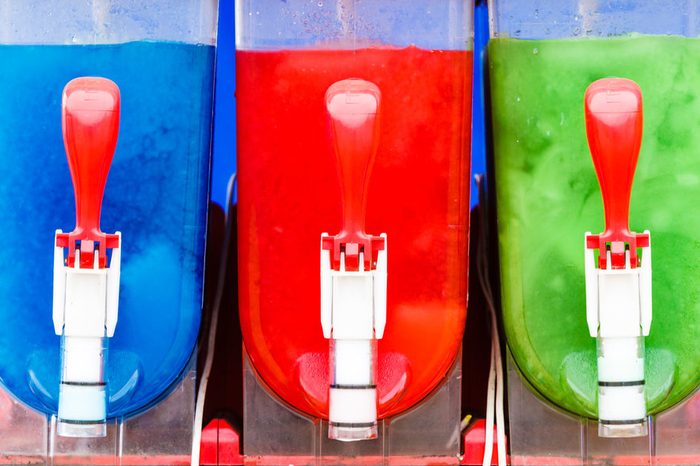 Food, cold sweet desert, summertime pleasure concept. Colorful ice cream slushy smoothie machine