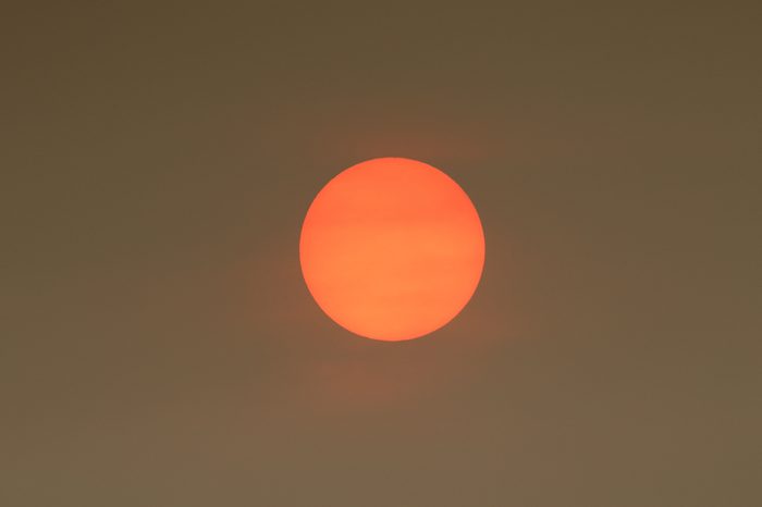 The Sun colour in the Uk was due to a weather phenomenon, Saharan dust, blown in by ex-hurricane Ophelia and also from debris, caused by fires in Portugal and Spain.