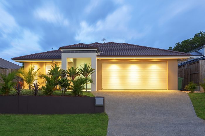 Well lit modern home exterior at dusk