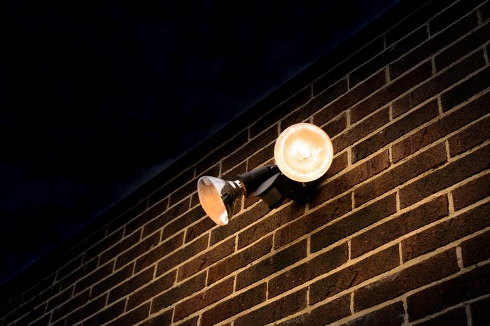 Flood light on external brick wall nighttime look up