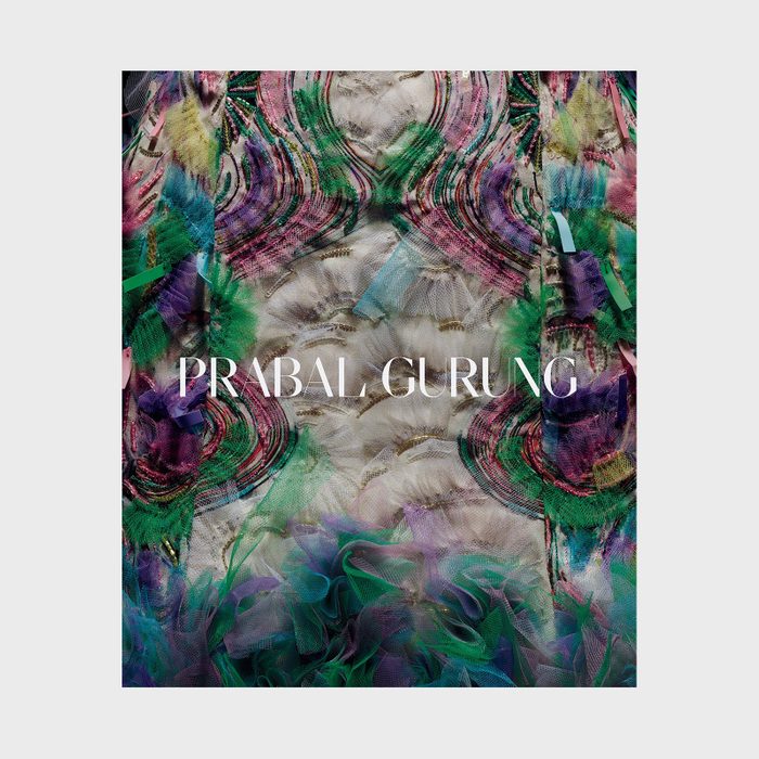 Intricate fabric features swirling patterns with vibrant colors; 
