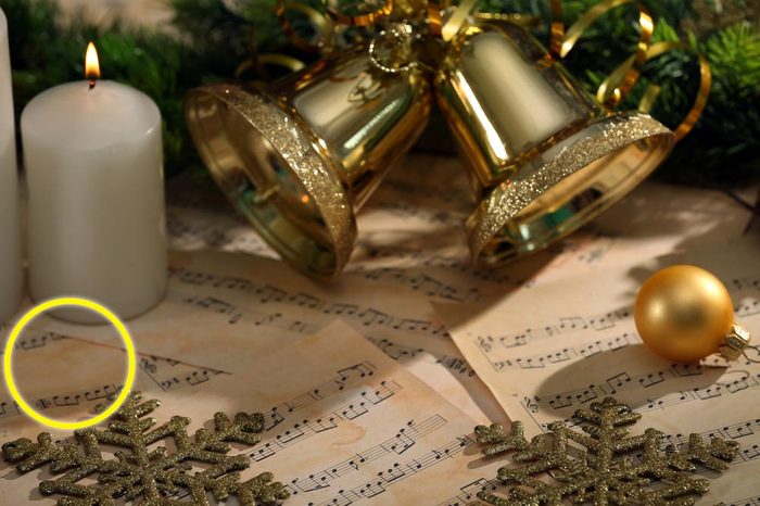 Christmas decorations on music sheets, closeup