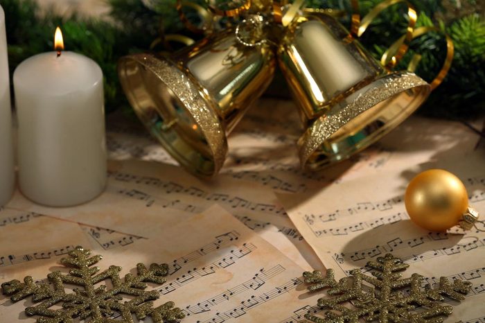 Christmas decorations on music sheets, closeup