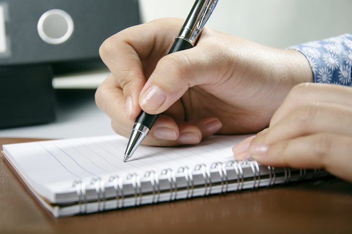Young adult writing personal diary