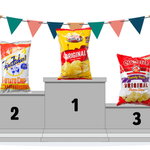 Three potato chip bags stand on a podium with colorful pennant banners. 