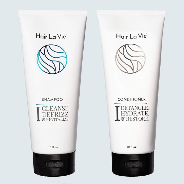 Shampoo and conditioner bottles are standing upright, labeled 