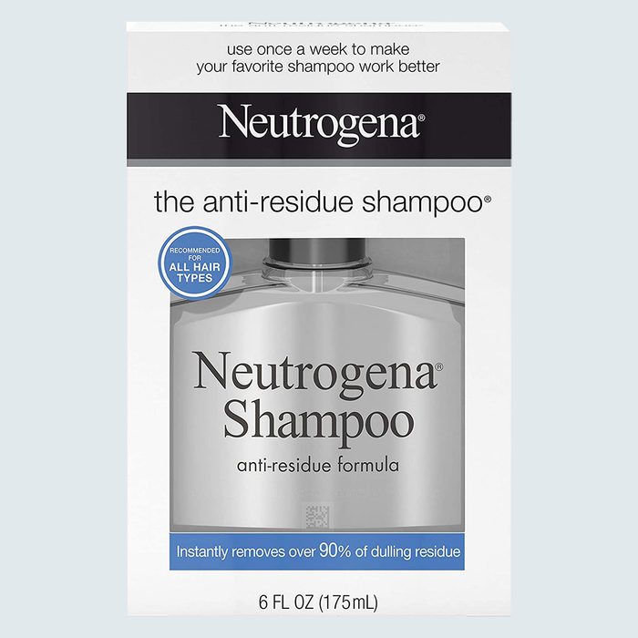 Shampoo bottle packaged in a box, promoting anti-residue formula, recommended for all hair types, with text about removing dulling residue.