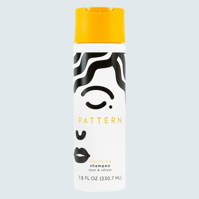 Bottle with swirling black lines and yellow cap, labeled 