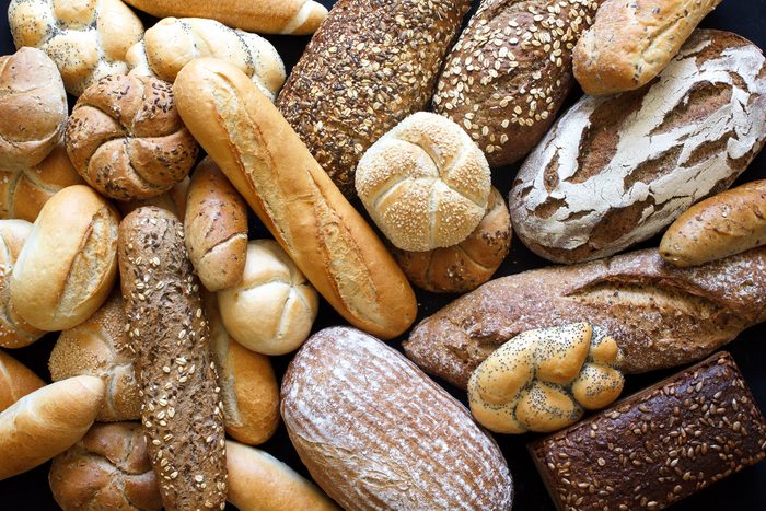 Many mixed breads and rolls shot from above