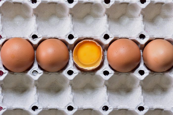Overhead view Stacking Brown chicken eggs in carton box,Fresh farm eggs with brown eggshell in cardboard packaging Natural healthy food and organic farming concept. Eggs in box