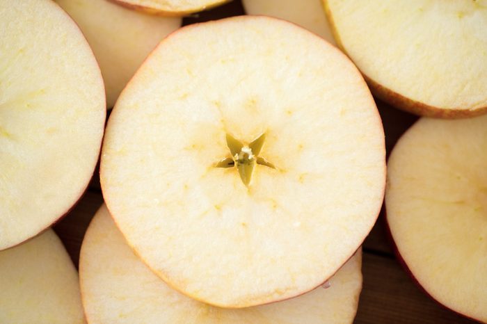 fruits and food concept - close up of apple slices