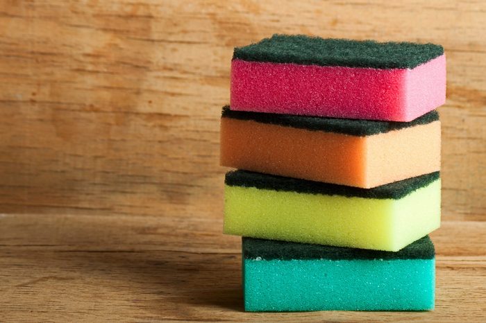 kitchen sponge close up on wood desk