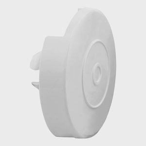 White circular cover resting, showing its ridged surface against a plain light background.