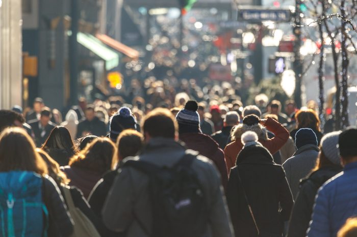 Crowd of people walking on a street in New York City