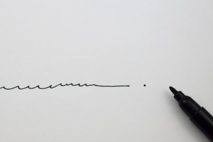 Female hand signing business papers. Close-up of woman signing document. Here's the final word. Point of no return