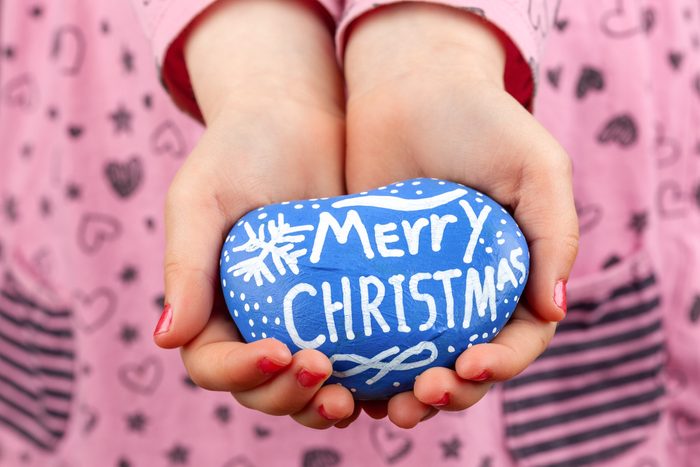 Midsection Of Girl Holding Easter Egg At Home
