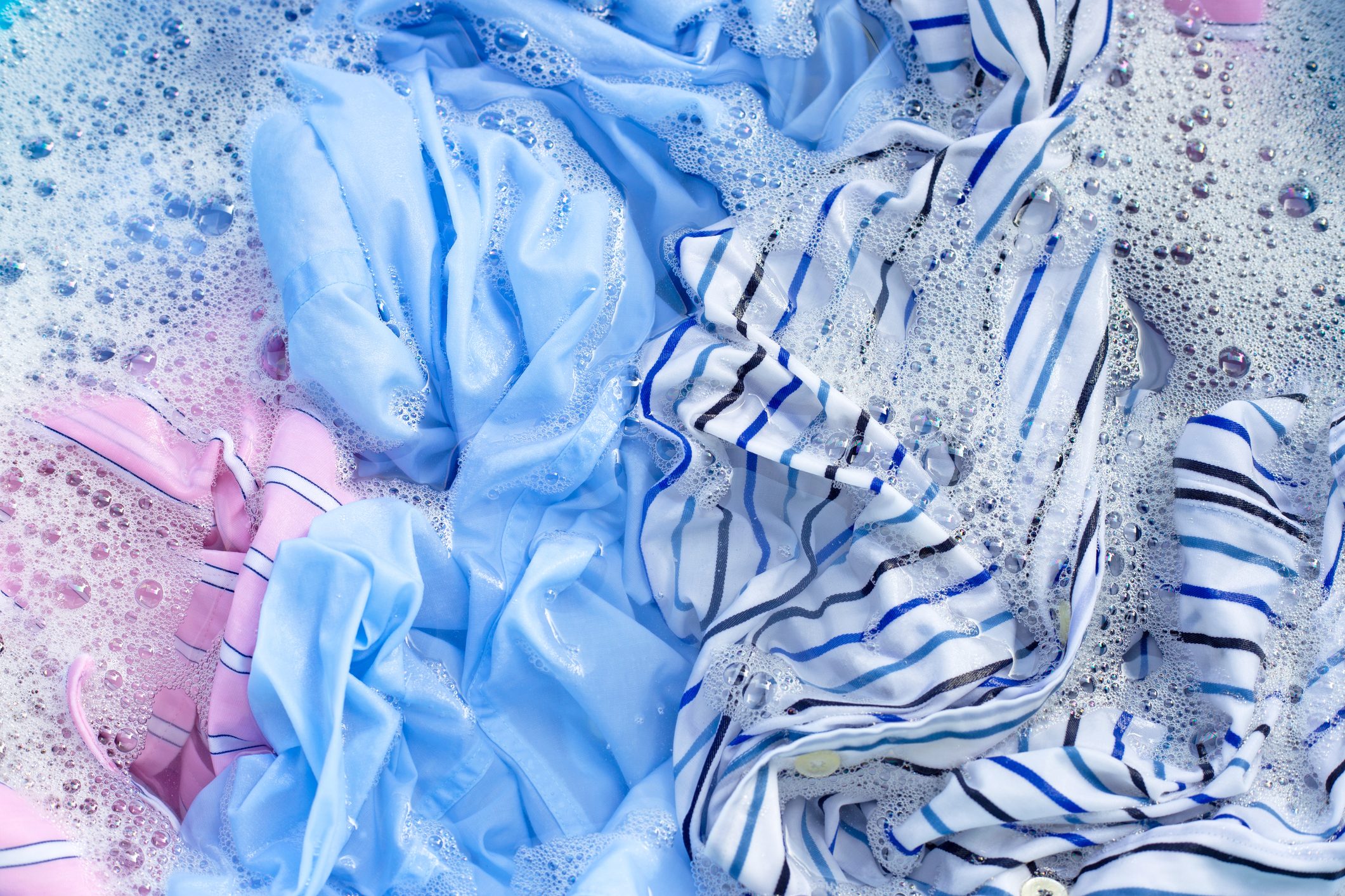 Full Frame Shot Of Wet Textile With Soap Sud