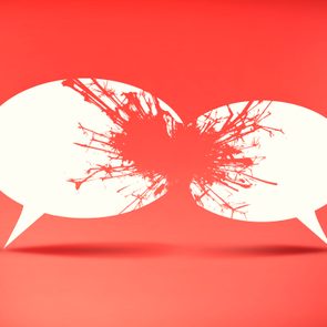 Two speech bubbles collide, creating a splash effect, set against a vibrant red background.