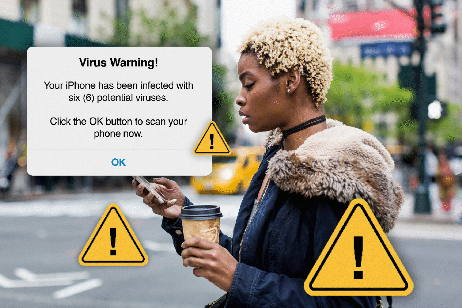 A woman holds coffee and checks her phone on a city street with virus warning pop-up text and caution icons displayed.