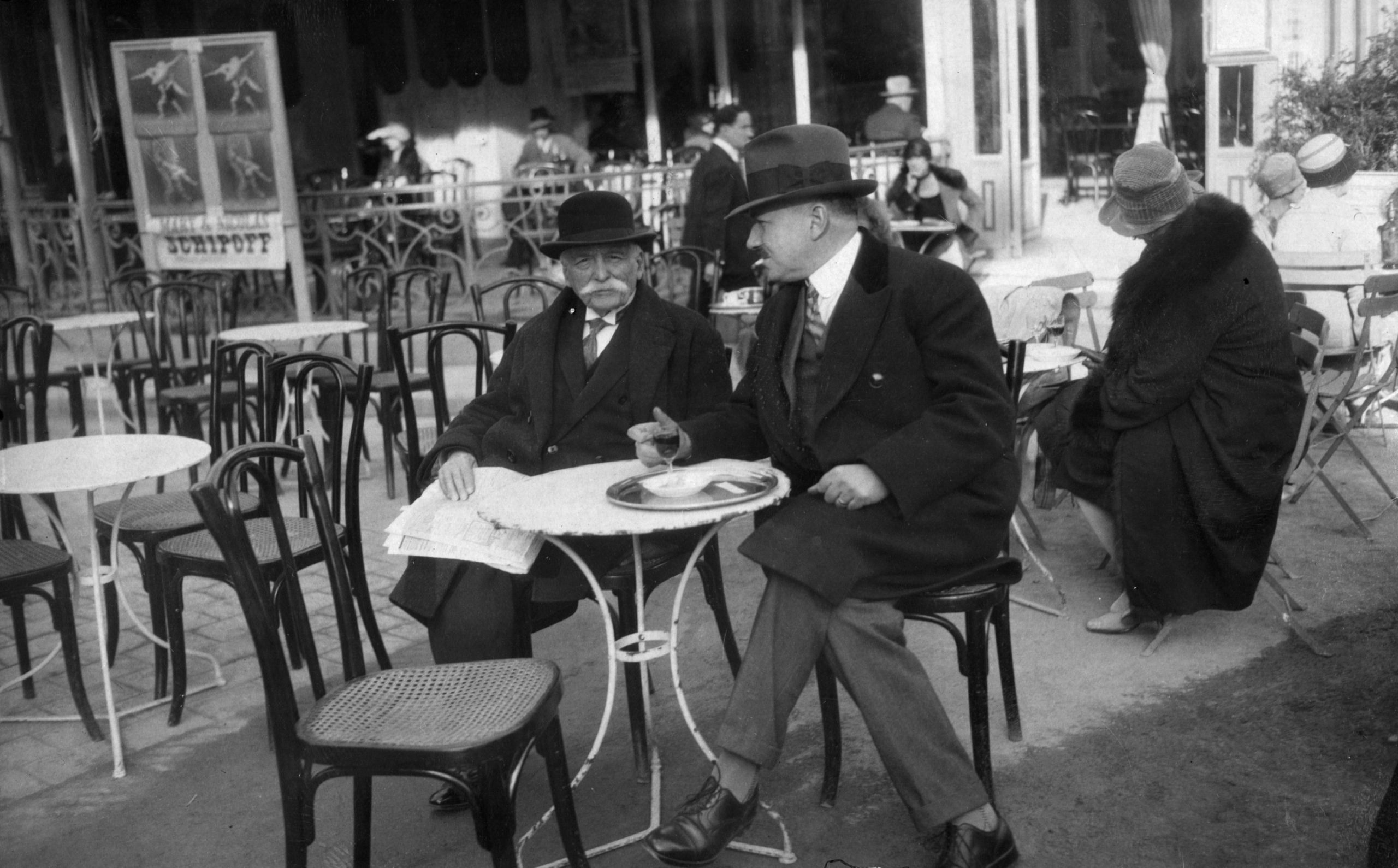 Two men sitting at a Paris Cafe
