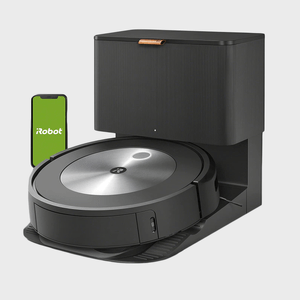 Robot vacuum sits in charging dock, accompanied by a phone displaying 
