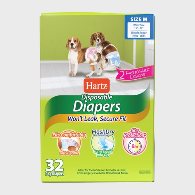 Box displaying Hartz disposable dog diapers; two dogs wear diapers against a green background. Features include 