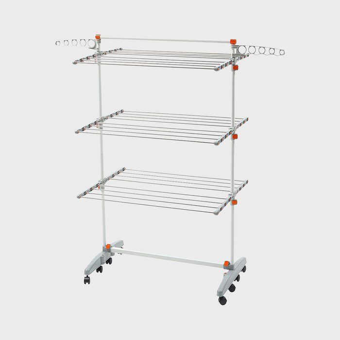 A foldable drying rack stands upright, featuring multiple wire tiers and side hooks, set against a plain white background.