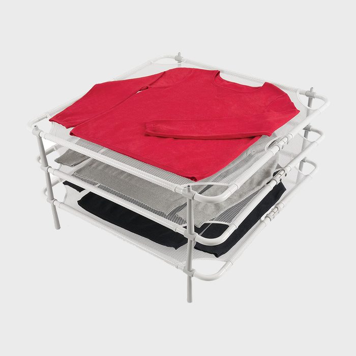 Rack holds red, gray, and black clothing on three mesh layers, assembled for drying in a white frame against a plain background.