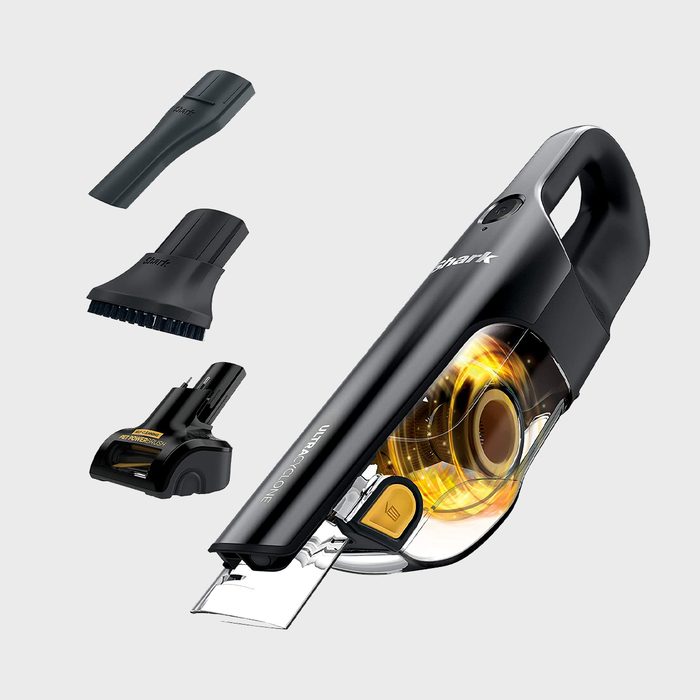 Handheld vacuum showing attachments; cleaning accessory for versatile tasks. Transparent dust container highlights swirling debris. Text includes brand name 