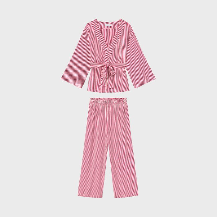 Red and white striped sleepwear set displayed against a plain background, featuring a wrap-style top with a tie and loose-fitting pants.