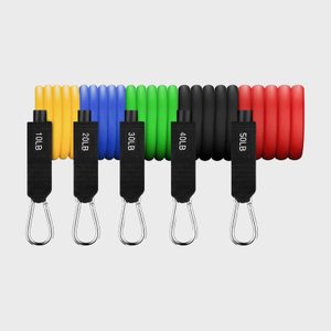Resistance bands hang on a wall, labeled by weight: 10LB, 20LB, 30LB, 40LB, 50LB, in yellow, blue, green, black, and red.