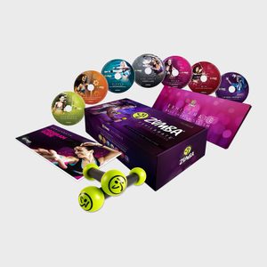Zumba DVDs spread out alongside a box, booklet, and weights with smiley faces, set against a plain background.