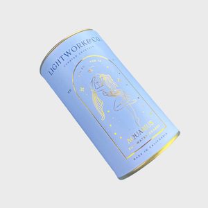 A light blue cylindrical container displays 