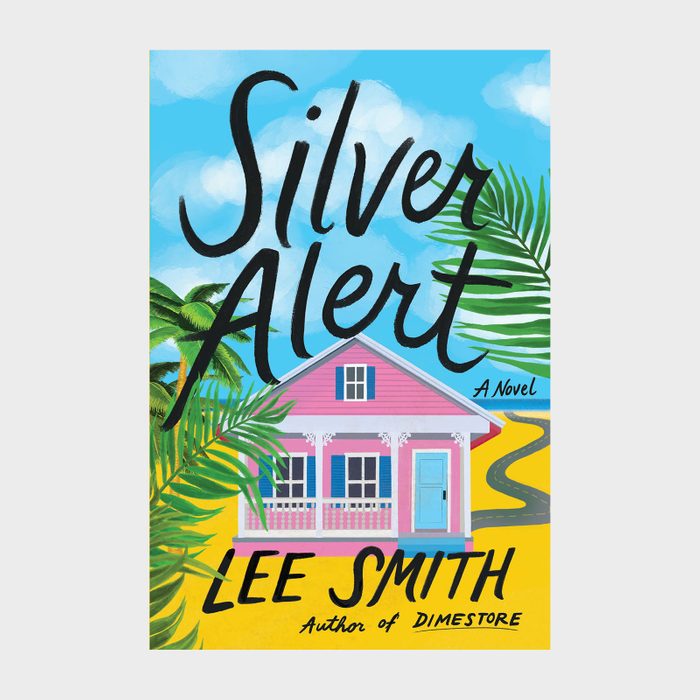 Colorful pink house front, surrounded by tropical palm leaves, under a bright blue sky. Text reads: 
