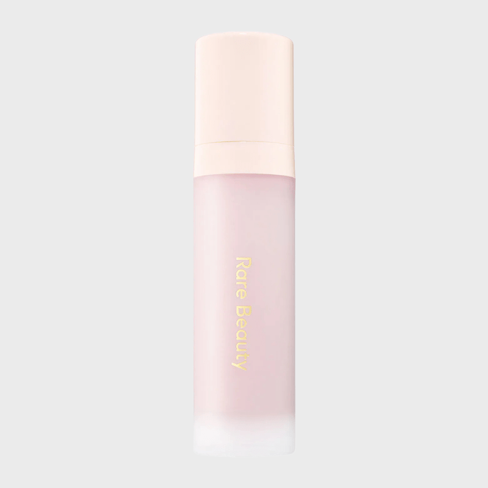 A frosted pink spray bottle labeled 