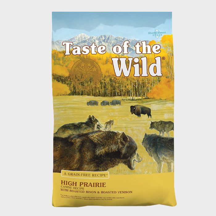 Bag depicts wolves and bison roaming a prairie with mountains; labeled 