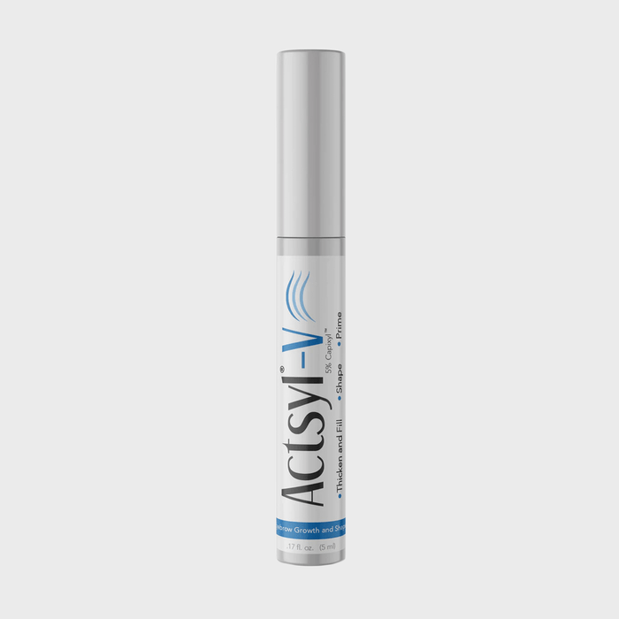 A cylindrical bottle stands upright, labeled 