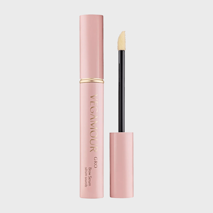 Pink tube with a metallic cap removed, revealing an applicator wand; labeled 