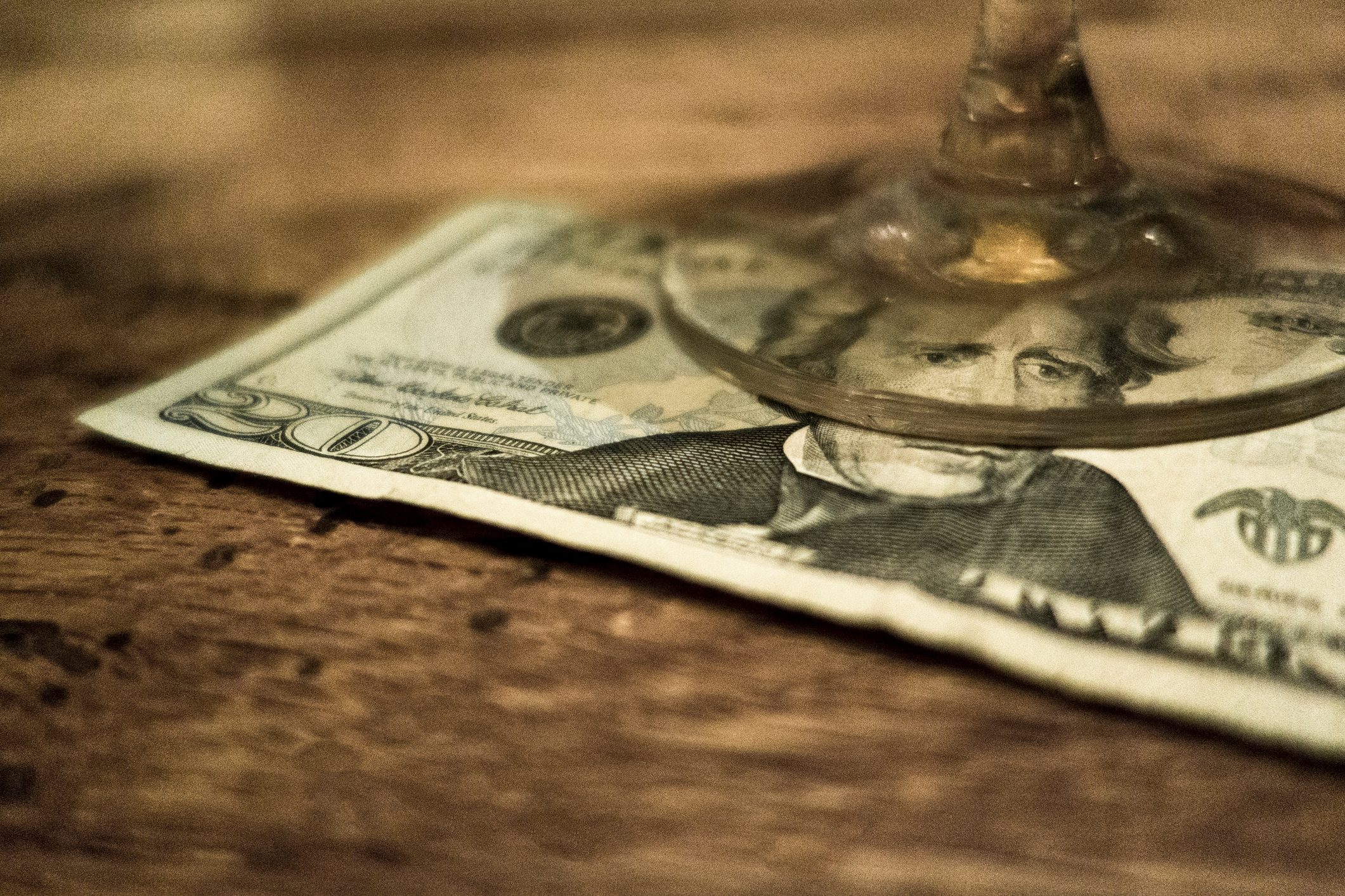 20 Dollar bill under a glass