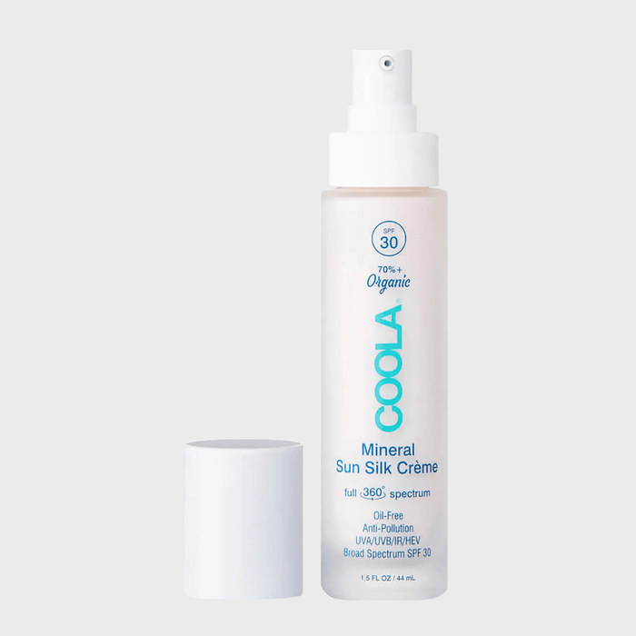 Bottle stands upright, cap removed, in a neutral space. Text: 